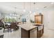 Bright kitchen features granite countertops, stainless steel appliances, and a breakfast bar at 2621 Redblush Ter, St Cloud, FL 34772