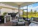 Outdoor patio features seating area and outdoor kitchen with grill and bar area at 2621 Redblush Ter, St Cloud, FL 34772