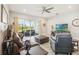 Open living area filled with natural light, complemented by neutral tones and a comfortable seating arrangement at 2621 Redblush Ter, St Cloud, FL 34772