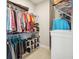 Walk-in closet featuring racks and shelving for maximum storage at 2621 Redblush Ter, St Cloud, FL 34772