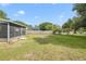 Expansive backyard featuring well-kept lawn with partial fence at 2626 Gentre St, Kissimmee, FL 34744