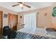 Comfortable bedroom with a ceiling fan, closet, and a window for natural light at 2626 Gentre St, Kissimmee, FL 34744