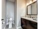 Compact half bathroom featuring a granite vanity and tile flooring at 2669 Sand Hill Point Cir, Davenport, FL 33837