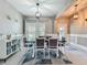 Well-lit dining area with stylish furnishings, neutral tones, and decorative accents at 2669 Sand Hill Point Cir, Davenport, FL 33837