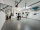 Organized three-car garage with ample storage solutions and an epoxy floor for a clean, finished look at 2669 Sand Hill Point Cir, Davenport, FL 33837