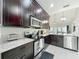 Well-equipped kitchen featuring granite countertops, stainless steel appliances, and ample cabinet space at 2669 Sand Hill Point Cir, Davenport, FL 33837