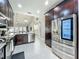 Spacious kitchen showcasing stainless steel appliances and rich wood cabinetry, offering a blend of functionality and style at 2669 Sand Hill Point Cir, Davenport, FL 33837
