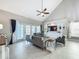 Comfortable living room showcasing a built-in entertainment center, neutral colors, and natural light at 2669 Sand Hill Point Cir, Davenport, FL 33837