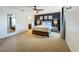 Large main bedroom showcasing a ceiling fan, wood-look furniture, and dark accent wall at 2669 Sand Hill Point Cir, Davenport, FL 33837