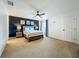 Bright and airy main bedroom with a ceiling fan, neutral walls and carpeted floor at 2669 Sand Hill Point Cir, Davenport, FL 33837