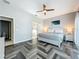 Bedroom boasts herringbone floors, and ensuite bathroom access at 2669 Sand Hill Point Cir, Davenport, FL 33837