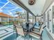 The covered patio is an outdoor dining area, complete with table and chairs at 2669 Sand Hill Point Cir, Davenport, FL 33837
