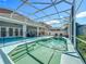 An inviting pool is fully enclosed with sun loungers and backyard patio at 2669 Sand Hill Point Cir, Davenport, FL 33837