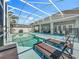 A fenced pool is surrounded by plenty of space for relaxing and lounging in the sun at 2669 Sand Hill Point Cir, Davenport, FL 33837
