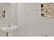 Half bath featuring a pedestal sink and decorative art at 2690 Pleasant Cypress Cir, Kissimmee, FL 34741