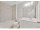 Bathroom with shower-tub combo and white vanity sink at 2690 Pleasant Cypress Cir, Kissimmee, FL 34741
