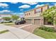 Inviting two-story home featuring a brick driveway and a two-car garage at 2690 Pleasant Cypress Cir, Kissimmee, FL 34741