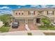 Charming townhome featuring a two-car garage and eye-catching red shutters at 2690 Pleasant Cypress Cir, Kissimmee, FL 34741