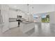 Eat-in kitchen island and stainless appliances with a living area view at 2690 Pleasant Cypress Cir, Kissimmee, FL 34741
