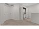 Laundry closet with stacked washer and dryer and bi-fold doors at 2690 Pleasant Cypress Cir, Kissimmee, FL 34741