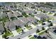 Aerial view of a neighborhood with well-maintained homes and landscaping at 2727 Harmonia Hammock Rd, Harmony, FL 34773