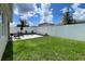 Expansive backyard featuring a stone paver patio and lush lawn at 2727 Harmonia Hammock Rd, Harmony, FL 34773