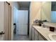 Bright bathroom with double sinks, a shower with curtain, and a view of the toilet at 2727 Harmonia Hammock Rd, Harmony, FL 34773