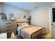 Charming bedroom with a cozy bed, dresser, and stylish decor for a comfortable retreat at 2727 Harmonia Hammock Rd, Harmony, FL 34773