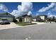 Attractive street view showcases the home's neat landscaping and well-maintained facade, adding to its appeal at 2727 Harmonia Hammock Rd, Harmony, FL 34773