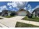 Well-kept property shows manicured lawn and attractive landscaping, creating an inviting and appealing front yard at 2727 Harmonia Hammock Rd, Harmony, FL 34773