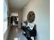 The spacious hallway features stylish decor, neutral colors, and plenty of natural light, creating a welcoming ambiance at 2727 Harmonia Hammock Rd, Harmony, FL 34773