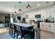 Spacious kitchen featuring a large island, pendant lighting and white cabinetry at 2727 Harmonia Hammock Rd, Harmony, FL 34773