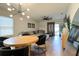 Well-lit living room showcases a comfortable couch, a stylish dining table, and modern decor at 2727 Harmonia Hammock Rd, Harmony, FL 34773