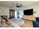 Comfortable living room featuring herringbone floors, stylish furniture, and access to the backyard at 2727 Harmonia Hammock Rd, Harmony, FL 34773