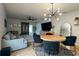 Open-concept living room features stylish lighting, modern furnishings, and a comfortable seating area at 2727 Harmonia Hammock Rd, Harmony, FL 34773