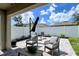 Landscaped patio with stone pavers and outdoor seating at 2727 Harmonia Hammock Rd, Harmony, FL 34773
