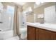 Full bathroom with shower-tub combo, white tile, and a modern vanity at 2737 N Poinciana Blvd # 92, Kissimmee, FL 34746