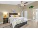 Spacious bedroom with a ceiling fan, natural lighting, and neutral decor at 2737 N Poinciana Blvd # 92, Kissimmee, FL 34746