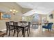 Dining area with a large table, chandelier, and seamlessly connects to the living room for easy entertaining at 2737 N Poinciana Blvd # 92, Kissimmee, FL 34746