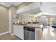 Modern kitchen with granite countertops that opens up to the living and dining areas at 2737 N Poinciana Blvd # 92, Kissimmee, FL 34746