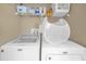Laundry room featuring a washer and dryer with storage above at 2737 N Poinciana Blvd # 92, Kissimmee, FL 34746
