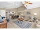 Open-concept living space with a view of the dining area and kitchen, offering a spacious and airy feel at 2737 N Poinciana Blvd # 92, Kissimmee, FL 34746