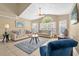 Inviting living room with tile floors, vaulted ceilings, and two sofas arranged around a central coffee table at 2737 N Poinciana Blvd # 92, Kissimmee, FL 34746