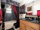 Bathroom featuring a dark granite countertop and artistic decor at 2810 Horton Rd, Kissimmee, FL 34744