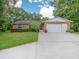 Charming one-story home with a two car garage, well-maintained lawn, and cozy curb appeal at 2810 Horton Rd, Kissimmee, FL 34744