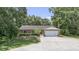 Charming single-story home featuring a two-car garage and well-maintained front yard with mature landscaping at 2810 Horton Rd, Kissimmee, FL 34744