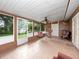 Enclosed sunroom features a table with seating and outdoor view at 2810 Horton Rd, Kissimmee, FL 34744