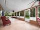 Spacious sunroom with multiple seating areas and windows with outdoor views at 2810 Horton Rd, Kissimmee, FL 34744