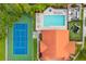 Aerial view featuring the tennis court, pool, clubhouse, and playground at 2867 Club Cortile Cir, Kissimmee, FL 34746