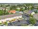 Aerial view of a condo complex including a pond and amenities at 2867 Club Cortile Cir, Kissimmee, FL 34746